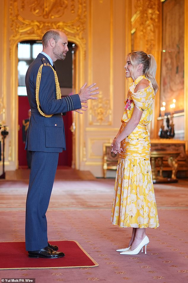 Prince William and Keely Hodgkinson at an investiture ceremony at Windsor Castle on Tuesday. The athlete revealed that the Prince, 42, shared that Charlotte, who recently celebrated her 10th birthday, is currently training for the 400m 'at the minute and the hurdles'