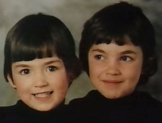 Mae West (L) and her older sister Heather, who was murdered at 16, pictured as children