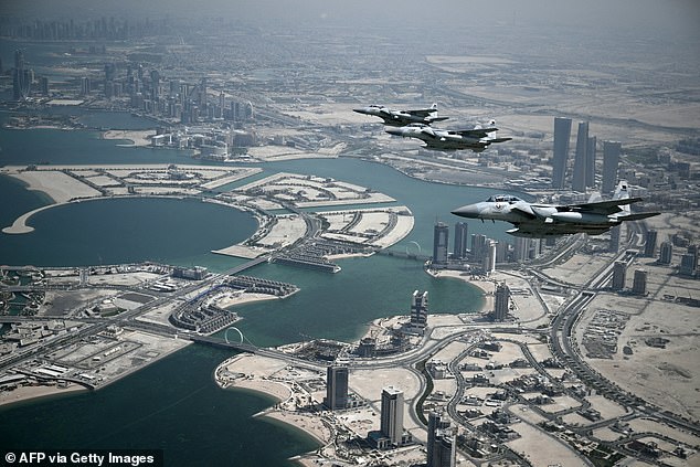 Qatari escorts off the wing of Air Force One as it flies over Doha