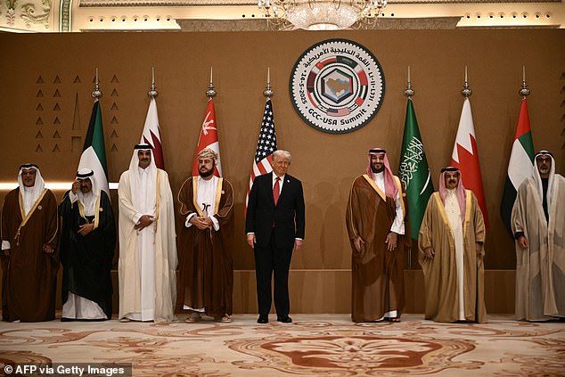 President Donald Trump poses with Gulf leaders and officials during the Gulf Cooperation Council summit in in Riyadh; From left to right: Bahrain's Crown Prince Salman bin Hamad al-Khalifa, the Emir of Kuwait Sheikh Meshal al-Ahmad al-Sabah, Qatar's Emir Sheikh Tamim bin Hamad Al-Thani,'Oman's Deputy Prime Minister Sayyid Asaad Tariq Taimur al-Said, US President Donald Trump, Saudi Crown Prince Mohammed bin Salman, Bahrain's King Hamad bin Isa al-Khalifa and other officials
