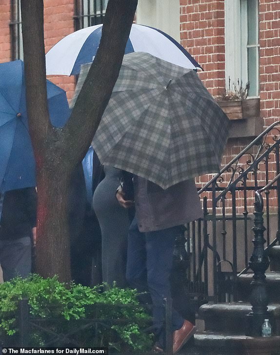 May 14th, 2025Cassie Venture is seen surrounded by umbrellas as she leaves to court for the Diddy case in NYC