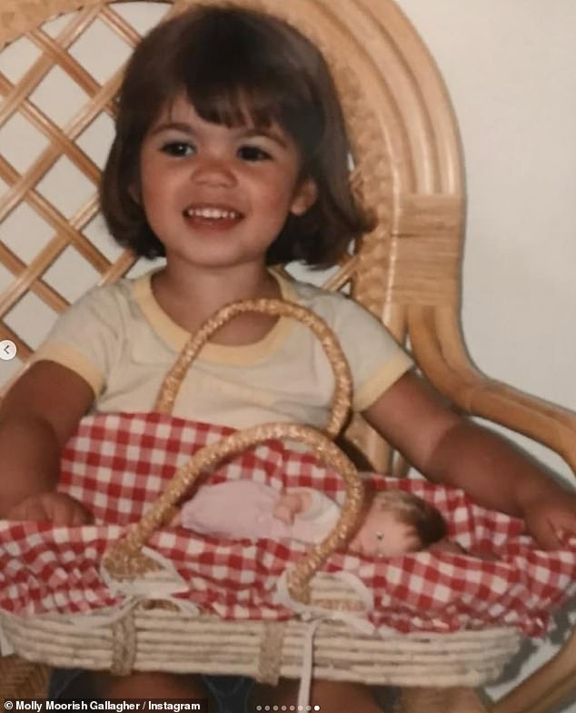 The final snap was a throwback of Molly posing with a baby doll