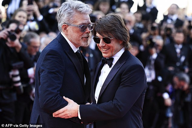 Tom's good friend and co-director Christopher shared a sweet moment together
