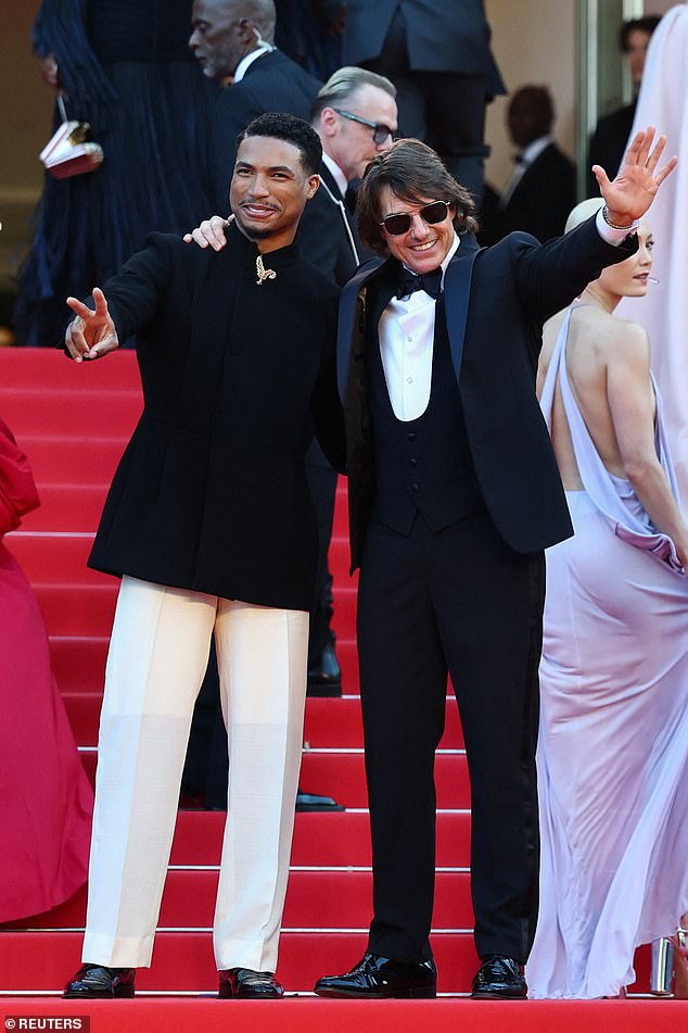 Greg Tarzan Davis and Tom posed arm in arm