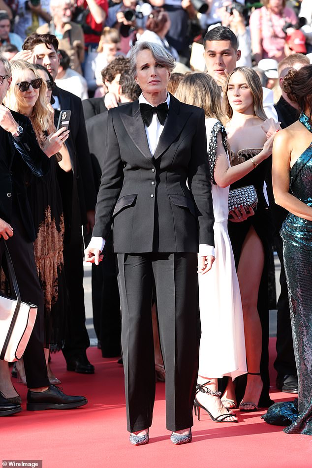 Andie MacDowell, 67, was suited and booted in a sophisticated tailored suit, teamed with sparkling court heels and a giant bow tie