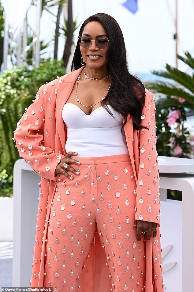 Angela Bassett, who returns to the franchise as Erika Sloane, the former CIA director, now President of the United States, wowed in a jewel-encrusted peach suit