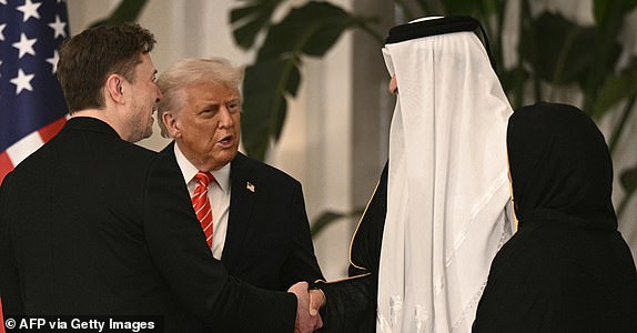 Senior Advisor to the US President Elon Musk greets US President Donald Trump (2nd-L), Qatar's Emir Sheikh Tamim bin Hamad al-Thani (2nd-R) and his spouse Sheikha Jawaher (R) ahead of a state dinner at the Lusail Palace in Doha on May 14, 2025. (Photo by Brendan SMIALOWSKI / AFP) (Photo by BRENDAN SMIALOWSKI/AFP via Getty Images)