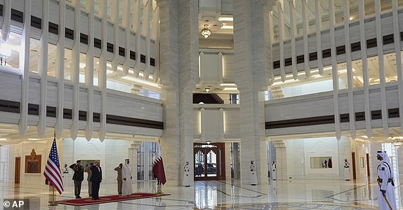 President Donald Trump and Qatar's Emir Sheikh Tamim bin Hamad Al Thani take part in an official welcoming ceremony at the Amiri Diwan in Doha, Qatar, Wednesday, May 14, 2025. (AP Photo/Alex Brandon)