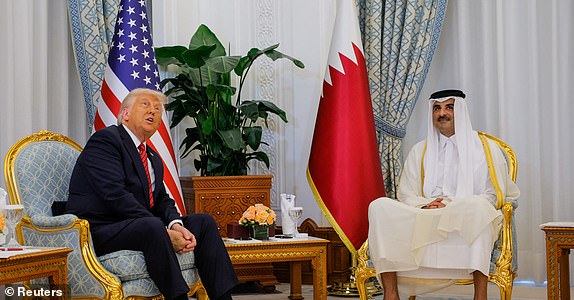 U.S. President Donald Trump meets Qatar's Emir Tamim bin Hamad Al Thani, in Doha, Qatar, May 14, 2025. REUTERS/Brian Snyder