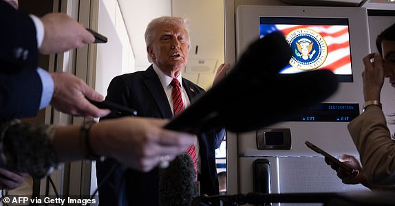 US President Donald Trump listens to questions as he speaks to members of the press on Air Force One while flying over Saudi Arabia on his way to Qatar on May 14, 2025. (Photo by Brendan Smialowski / AFP) (Photo by BRENDAN SMIALOWSKI/AFP via Getty Images)