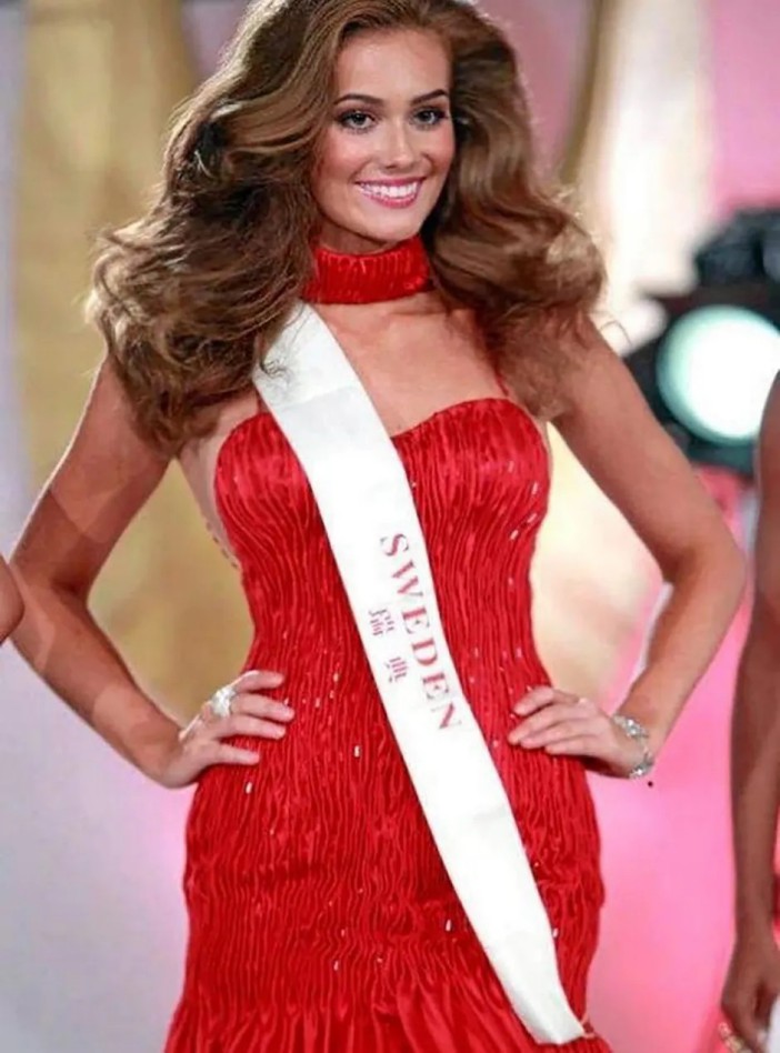 Nicoline, former beauty queen representing Sweden in a red dress.