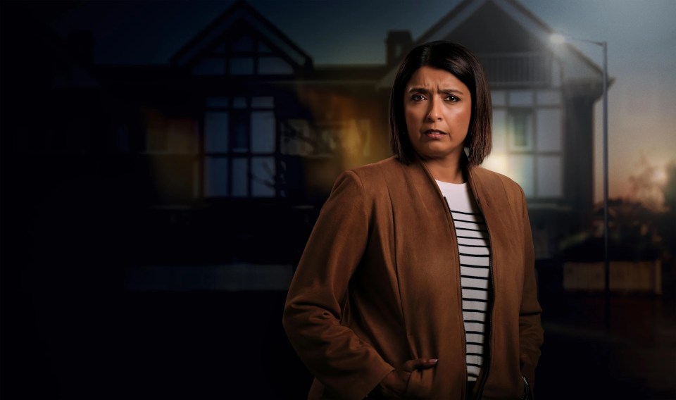 A woman standing in front of a house at night, looking concerned.