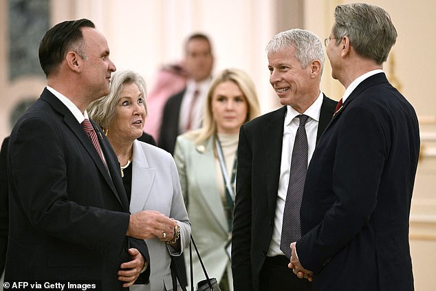 White House press secretary Karoline Leavitt (center) wore a mint green pantsuit during meetings Tuesday at the Royal Court between President Donald Trump and Saudi Crown Prince Prince Mohammed bin Salman or 'MBS'