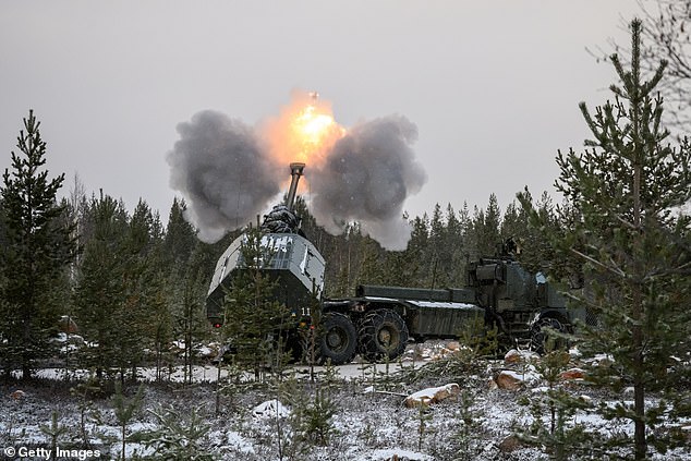 A Swedish artillery team fires a projectile from an Archer self-propelled Howitzer during the NATO Exercise Lightning Strike on November 20, 2024 near Heinu, Finland
