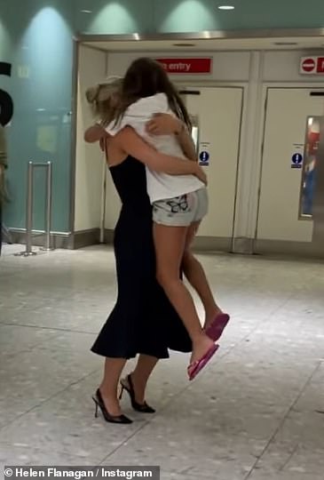 The reality star cut a glamorous figure in a black plunging midi dress and towering heels as she waited in arrivals