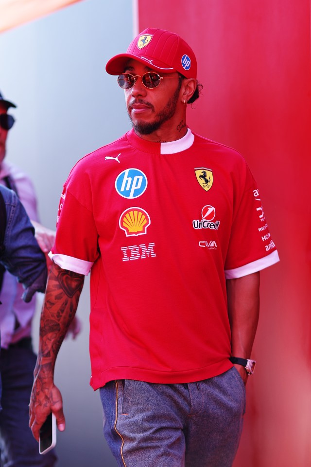 Lewis Hamilton in a red Ferrari shirt and cap.