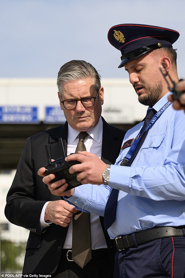The PM discussed the proposal with his Albanian counterpart Edi Rama during talks in Tirana today. Pictured: Starmer listens to a drone operator as he is shown the procedures carried out by search teams
