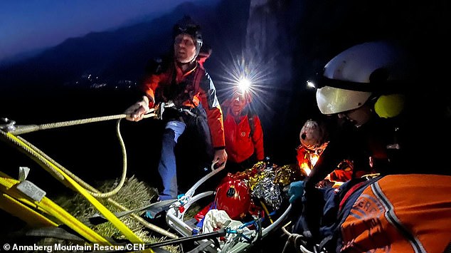 Photos show the man being secured by ropes as medics and alpine police work to lift him to safety