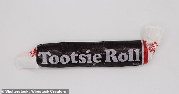 SURREY, CA - Nov 03, 2022: A closeup of Tootsie Roll taffy chocolate candy isolated on the white background,; Shutterstock ID 2476832513; purchase_order: -; job: -; client: -; other: -