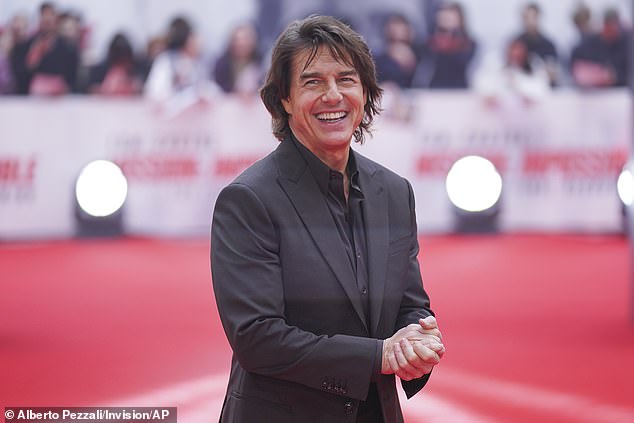 Tom, 62, looked suave for the evening as he sported a black blazer and trousers along with a matching shirt as he posed for snaps on the red carpet