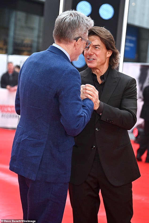 Tom shared a moment with director Christopher as they made their way onto the red carpet