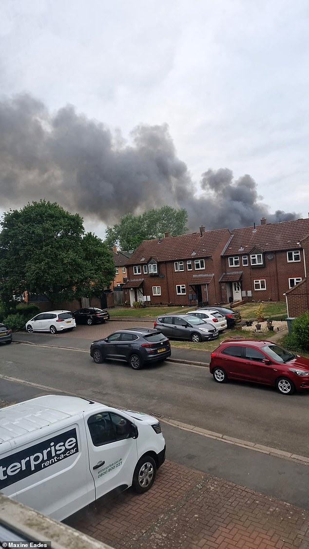 Plumes of smoke billowing from the sky amid the blaze at the former heritage centre today