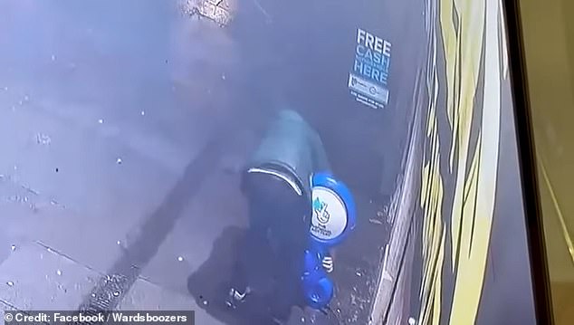 Pictured: a hooded youngster caught on CCTV stealing a sign from outside of one of Mr Munir's shops