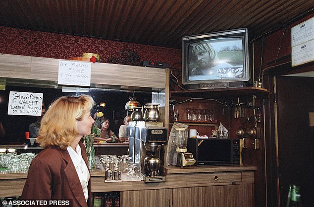 Rogers was arrested after a car chase in Kentucky in 1995. Pictured here is a bartender watching the shocking arrest live on television