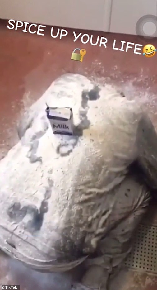 Another clip shows a prisoner on the floor covered in a white powdery substance and milk as a fellow inmate shouts about how he has had 'too much spice today'