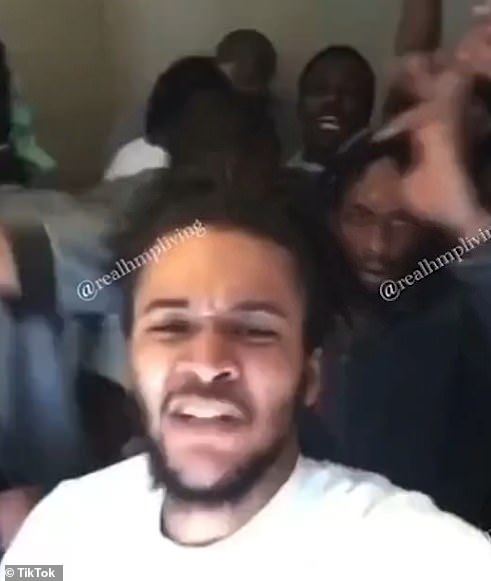 The smiling inmates filmed themselves gathered in a cell enjoying what appears to be a party