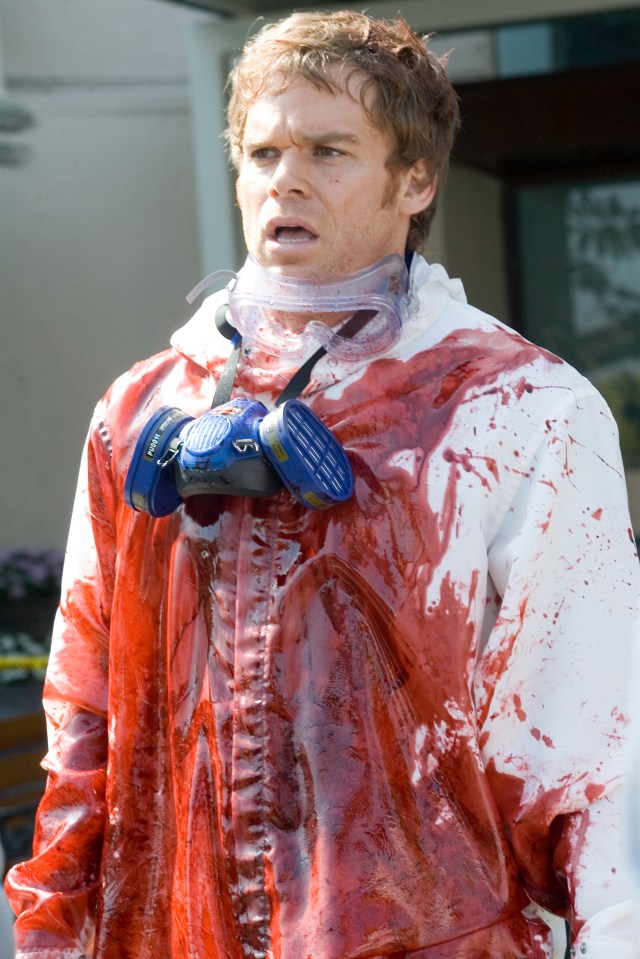 Michael C. Hall as Dexter in a blood-splattered protective suit.