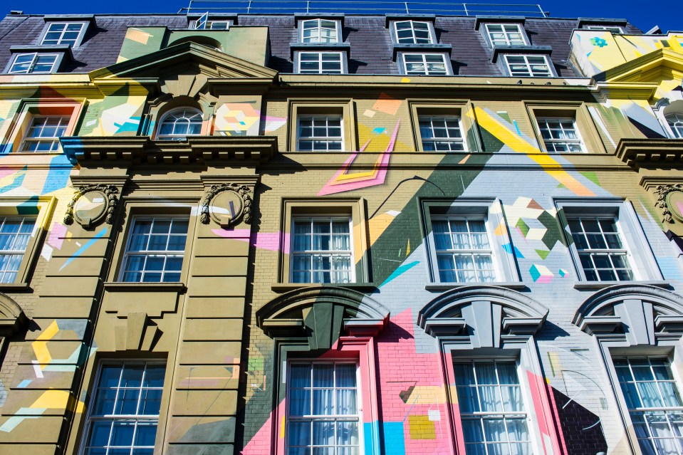 Megaro Hotel with colorful geometric mural.