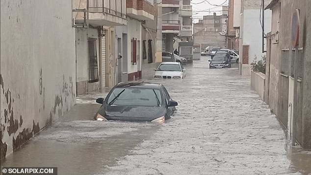 Shocking video footage shows the city's streets submerged by fast-flowing floodwater as motorists try to navigate their way through the chaos