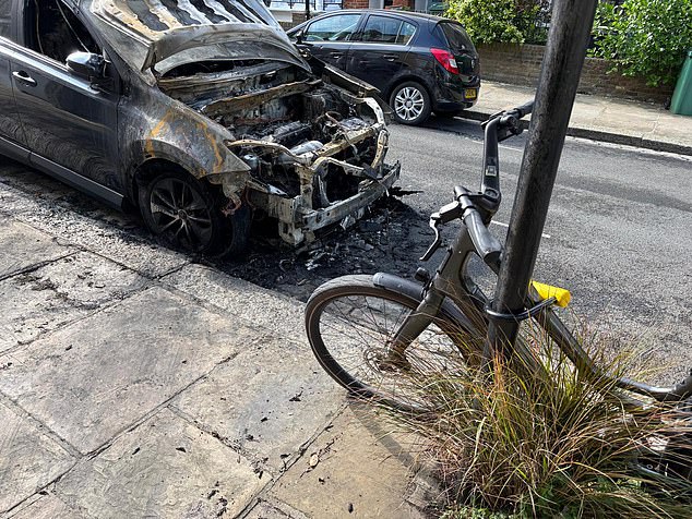 The burnt out remains of the Toyota Rav 4. The owner of the car initially thought it was a battery fault