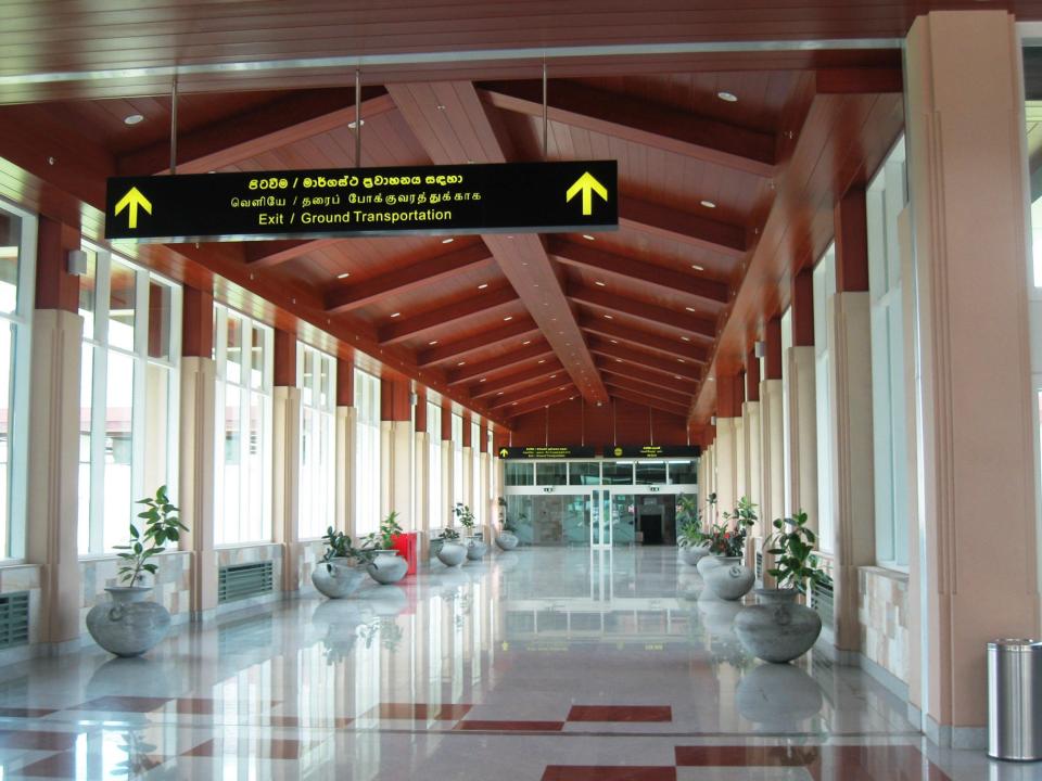 Mattala Rajapaksa International Airport terminal hallway with exit signage.