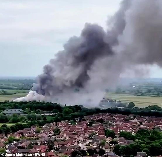 Video grab from footage shows a huge cloud of smoke as fire breaks out at a former RAF airfield at Bicester Motion in Oxfordshire