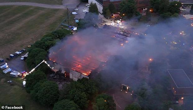 An aerial view shows the fire ripping through the building last night