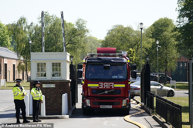 A fire engine leaves Bicester Motion in Oxfordshire where two firefighters and a member of the public have died