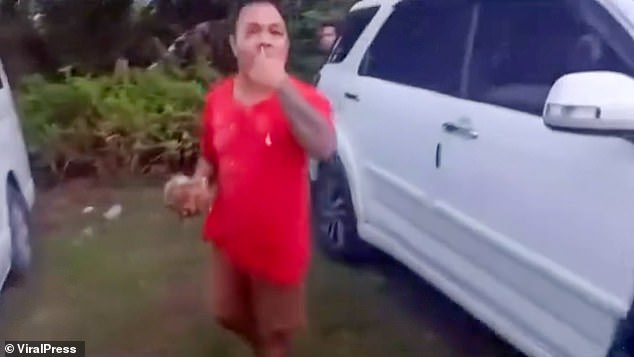 Footage shows Nino, seen in a red t-shirt, standing by as a number of his fellow cabbies launched an attack on the Brit