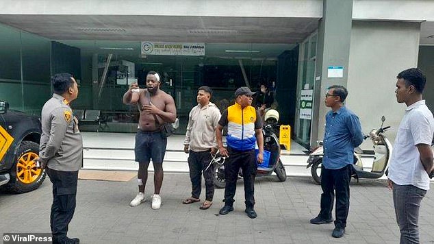 Pictures show Joseph (second from left) outside the police station, seemingly with a bandage on his head