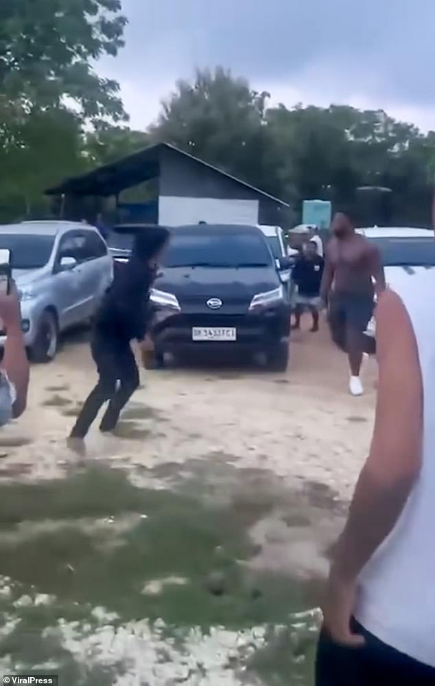 The chaotic footage shows a group of locals taking on the British tourist after the alleged attack