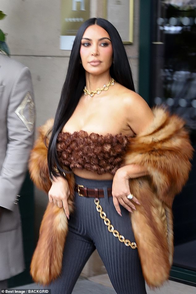 Kim looked incredible at the bachelorette, flashing her toned midriff in a bandeau top and high-waisted dark grey leggings that showed off her hourglass curves