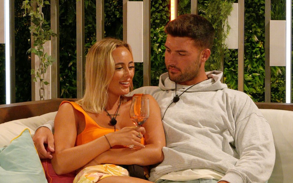 Millie Court and Liam Reardon from Love Island sharing a drink.