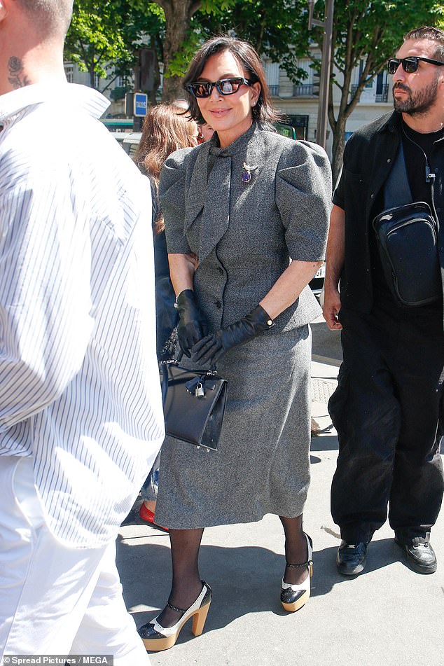Her mother Kris Jenner was also seen making her way into the venue, looking chic in a structured grey jacket that she paired with a matching skirt and chunky heels