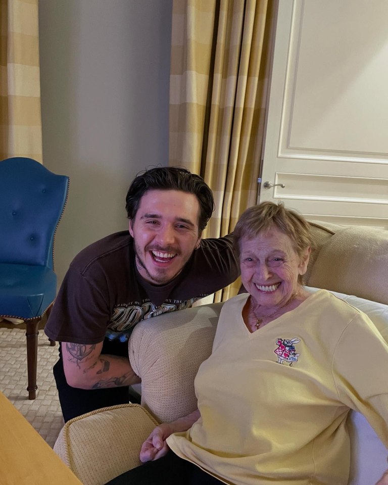 Brooklyn Beckham and his grandmother smiling together.