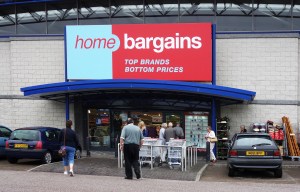 Home Bargains discount store entrance with shoppers.