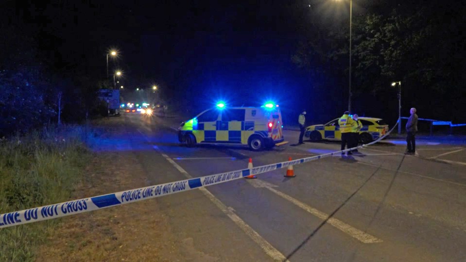Emergency services at night at a scene marked with police tape.