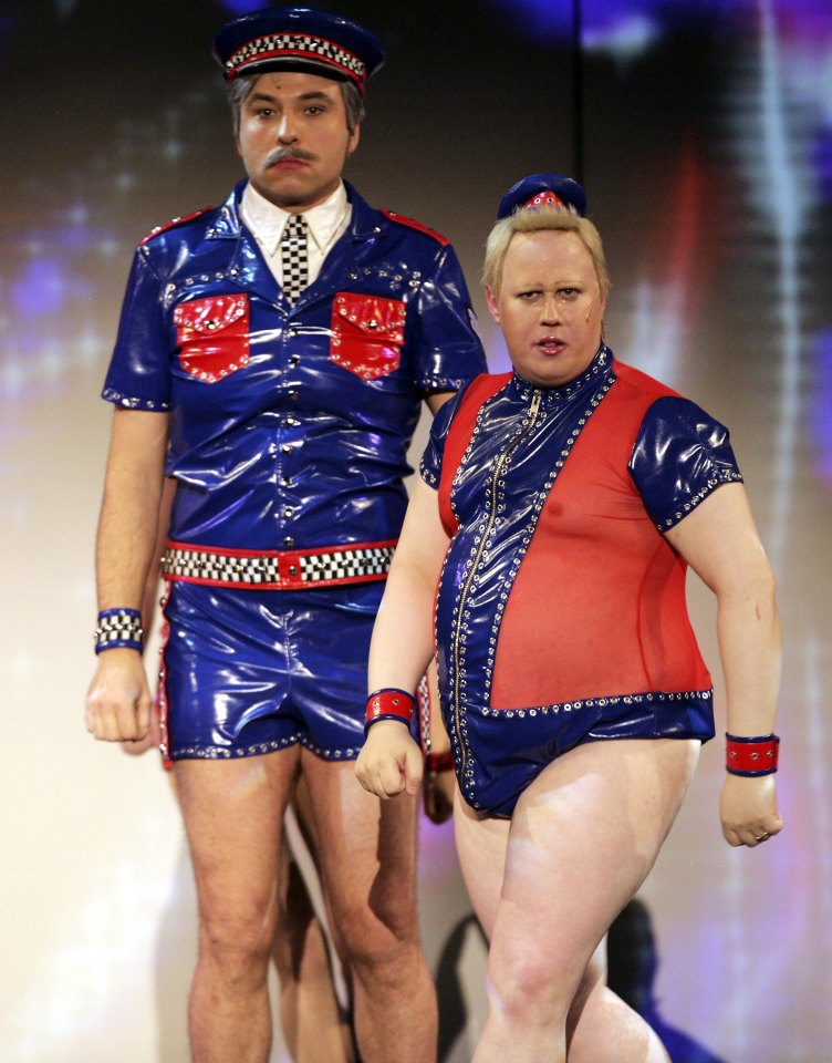 Matt Lucas and David Walliams in costume on stage.
