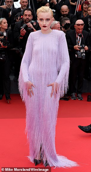 Julia Garner (pictured) captured the audience with her feather purple gown