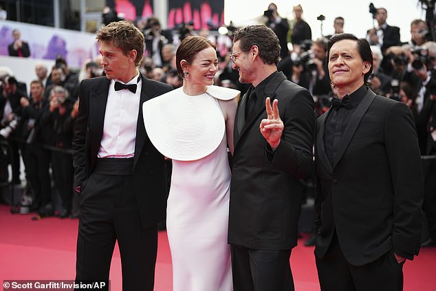 Emma couldn't contain her laughter as Pedro stuck up a peace sign, pictured with Austin, left, and Clifton Collins, right